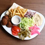 Falafel platter with chips, salad, dips and pickles